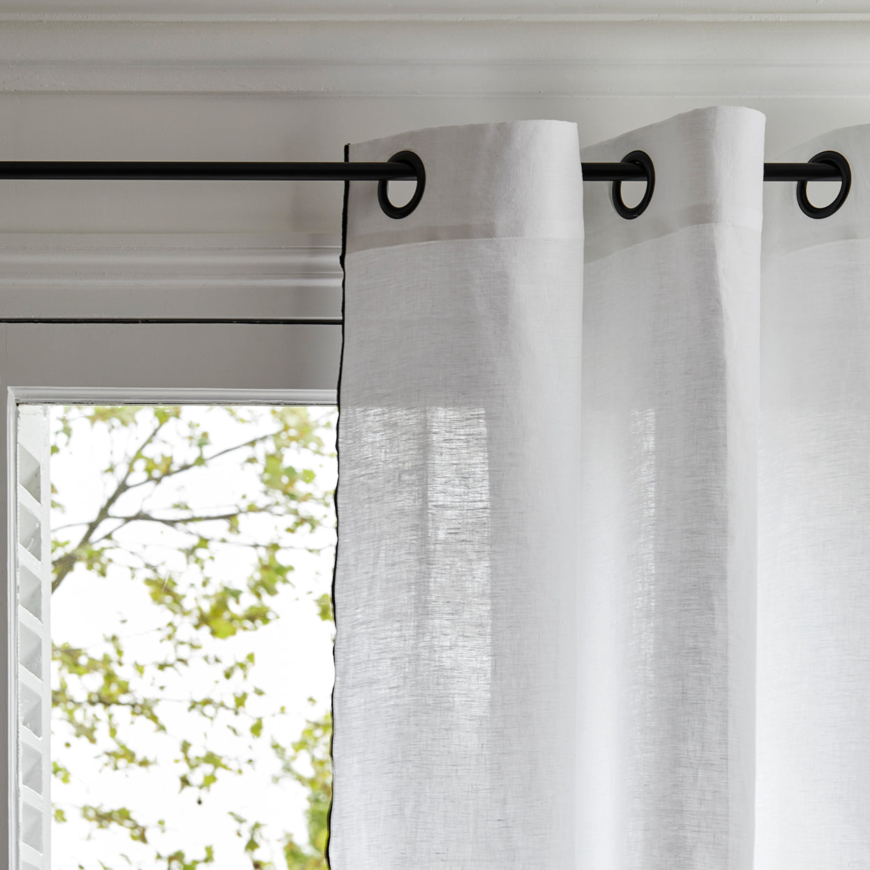 Carlina white and black bourdon stitch black eyelet curtain